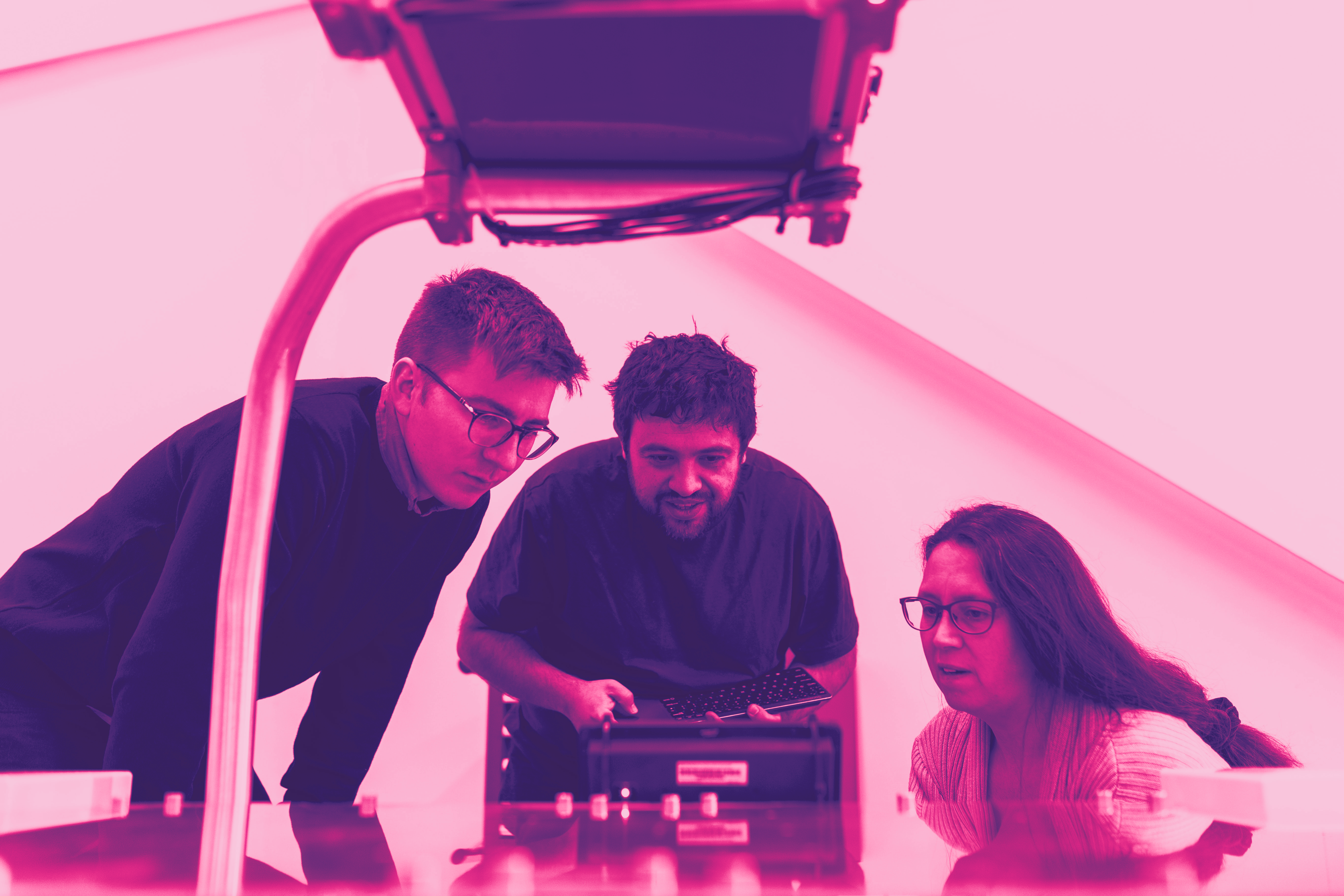 Mentor watching her trainees experiment