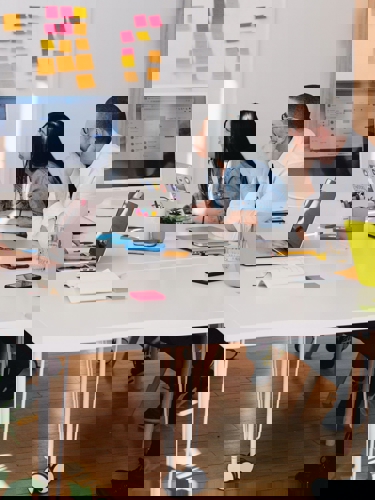 Group of people using post-it notes and planning
