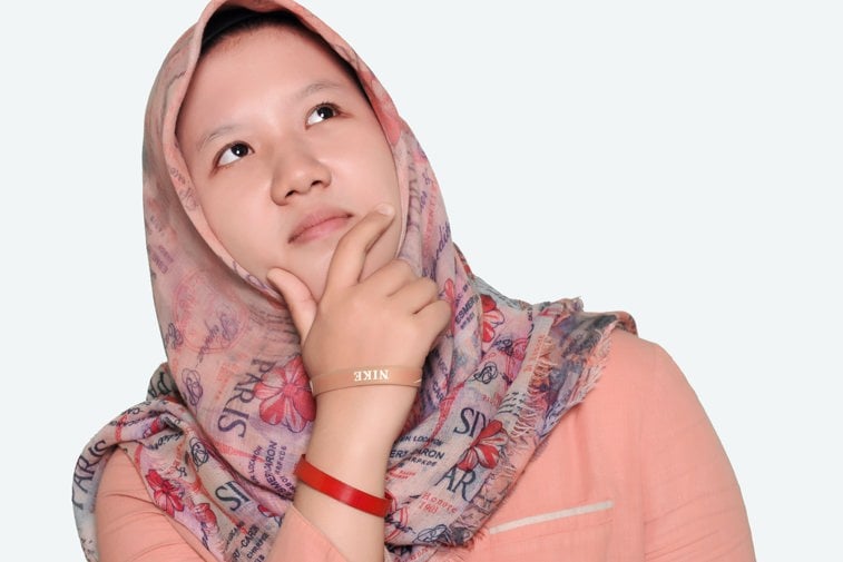 Young woman looks pensive
